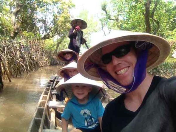 Touring the Mekong Delta on a traditional longboat